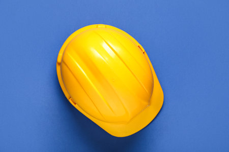 Hardhat on blue background, top viewの写真素材