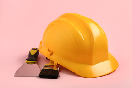 Hardhat with brush on pink background, closeupの写真素材