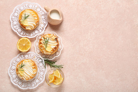 Tasty lemon tartlets with jug of milk on grunge background with space for textの写真素材
