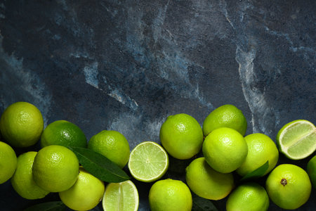 Fresh ripe limes on blue backgroundの写真素材