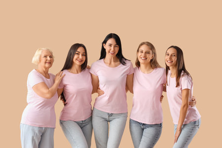 Group of beautiful women hugging on beige background. Feminism conceptの写真素材