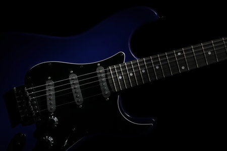 Modern electric guitar on black backgroundの写真素材