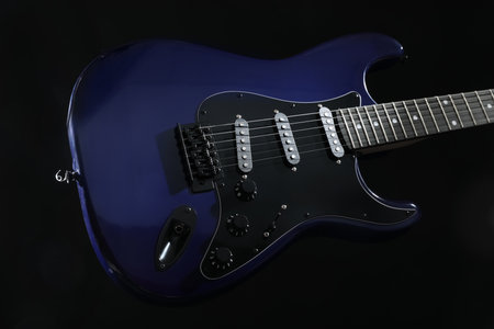 Modern electric guitar on black backgroundの写真素材