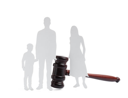 Judge's gavel with figures of family isolated on white backgroundの写真素材