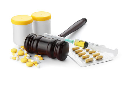Judge gavel with different pills and syringe isolated on white background. Concept of health care reformの写真素材