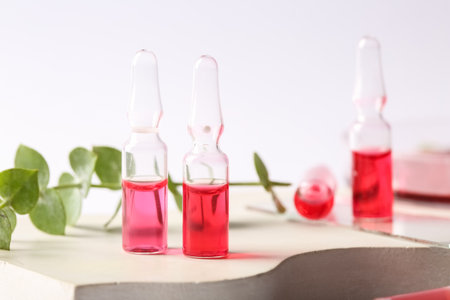 Glass ampoules on light backgroundの写真素材