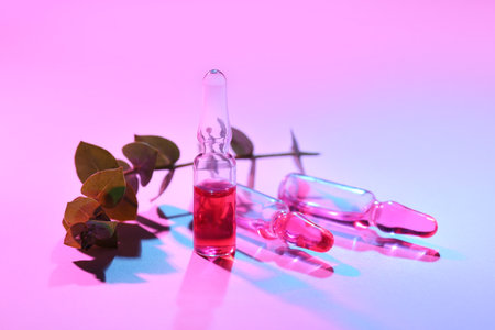 Glass ampoules on color backgroundの写真素材