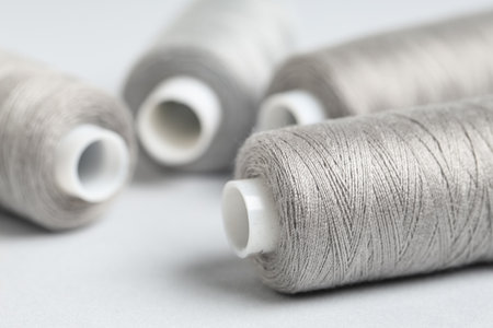 Spools of thread on gray background, closeupの写真素材