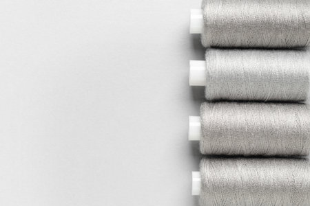 Spools of thread on gray backgroundの写真素材