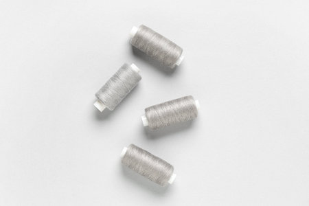 Spools of thread on gray background