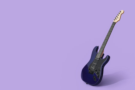 Modern electric guitar on lilac backgroundの写真素材