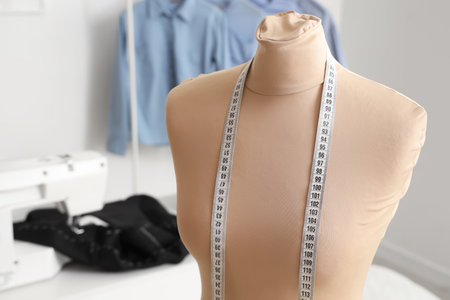 Mannequin with tape measure in tailor's atelier, closeupの写真素材