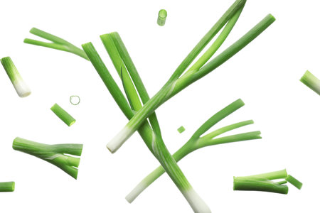 Flying fresh green onion with slices on white backgroundの写真素材
