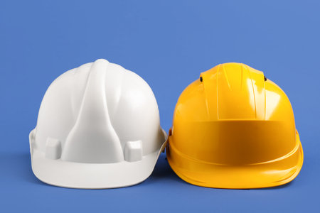Hardhats on blue background, closeupの写真素材