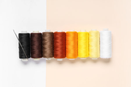 Different thread spools on color background