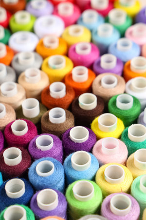 Many different thread spools as background