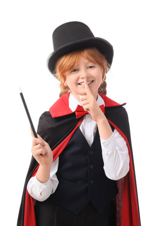 Young magician with magic wand showing silence gesture on white backgroundの写真素材