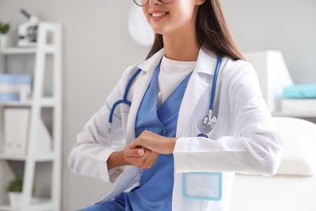 Female doctor using sign language in clinicの写真素材