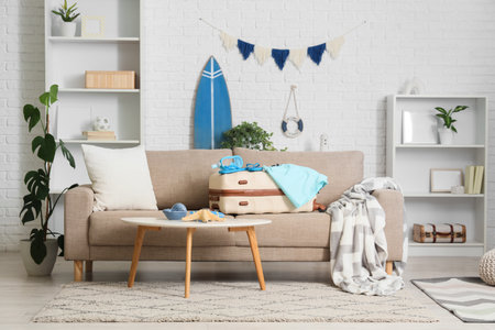 Interior of living room with sofa, children's swimsuit and beach accessoriesの写真素材
