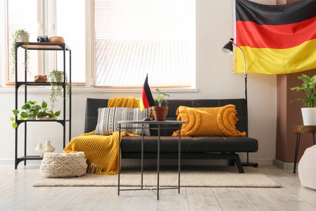 Interior of living room with German flags, sofa and tableの写真素材