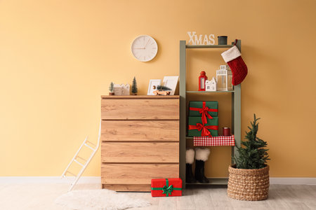 Interior of living room with clock, commode and Christmas treeの写真素材