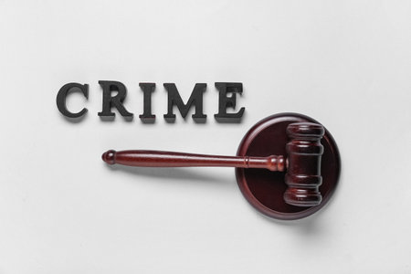 Word CRIME with judge's gavel on light backgroundの写真素材
