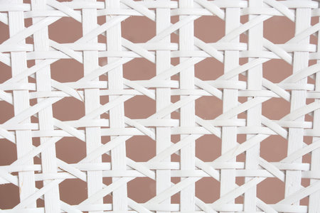 White wicker texture on brown background, closeupの写真素材