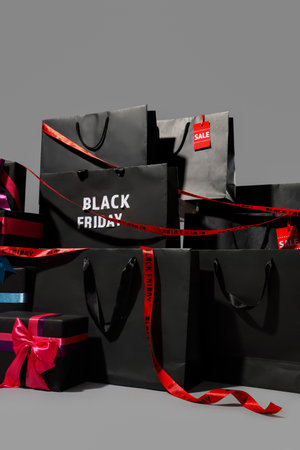Shopping bags and gift boxes on white background. Black Friday sale conceptの写真素材