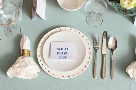 Elegant table setting for Nobel prize day with clean plates, top viewの写真素材
