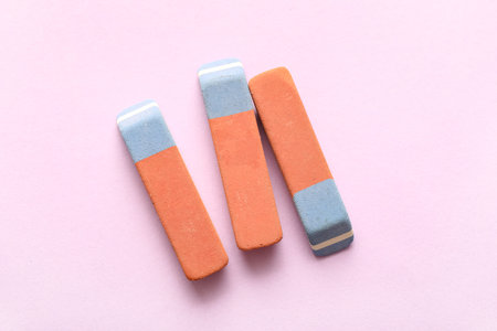 School erasers on lilac backgroundの写真素材
