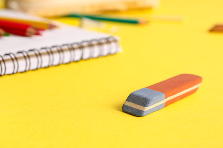 School eraser on yellow backgroundの写真素材