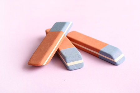 School erasers on lilac backgroundの写真素材