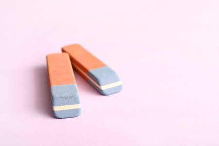 School erasers on lilac backgroundの写真素材