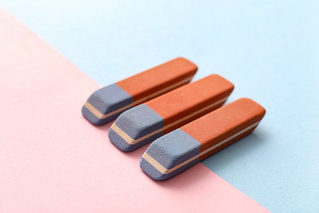 School erasers on color backgroundの写真素材