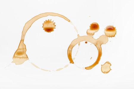 Brown coffee stains on white backgroundの写真素材