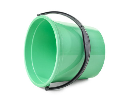Overturned green plastic bucket on white backgroundの写真素材
