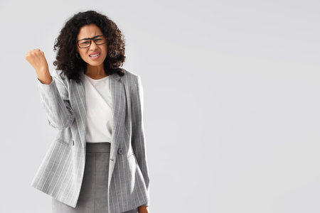 African-American businesswoman on light backgroundの写真素材