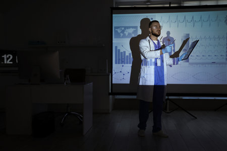Male doctor with clipboard analyzing scientific data near projector screen in laboratory