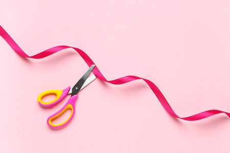 Grand opening ceremony with pink scissors cutting red ribbon on pastel background
