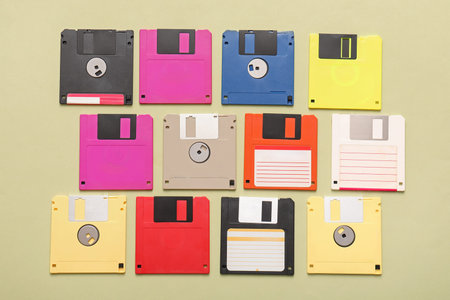 Composition with different floppy disks on green background
