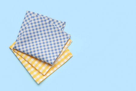 Different checkered napkins on blue background