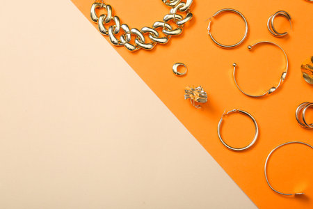 Beautiful golden jewelry on colorful background