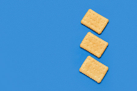 Tasty sweet cookies on blue background