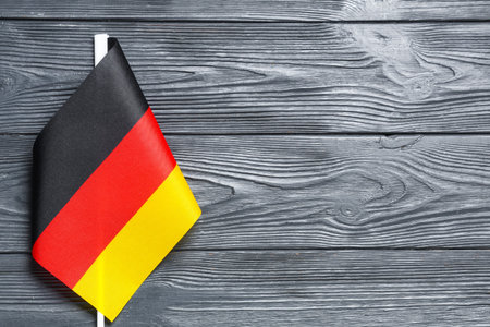 Flag of Germany on dark wooden background