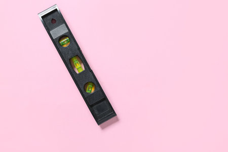 Black building level on pink background