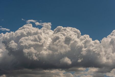 Clouds in the sky. The wonderful spectacle of a sky full of clouds. Depth and three-dimensionality of a cloudy sky.の写真素材