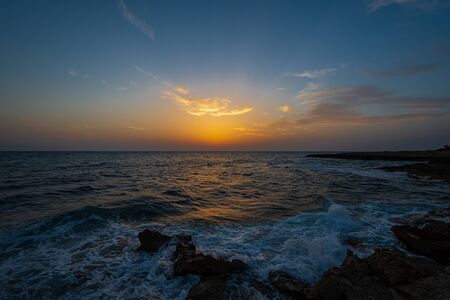 Adriatic sea. Ostuni, Puglia. Sunrise. Renowned seaside resort located in the heart of Salento. This stretch of coast is punctuated by a series of rocky beachesの写真素材