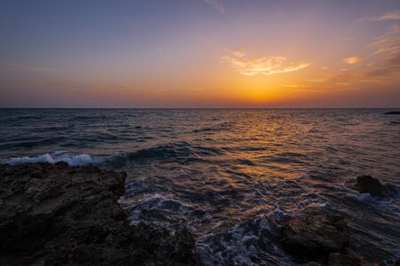 Adriatic sea. Ostuni, Puglia. Sunrise. Renowned seaside resort located in the heart of Salento. This stretch of coast is punctuated by a series of rocky beachesの写真素材