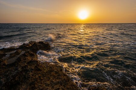 Adriatic sea. Ostuni, Puglia. Sunrise. Renowned seaside resort located in the heart of Salento. This stretch of coast is punctuated by a series of rocky beachesの写真素材