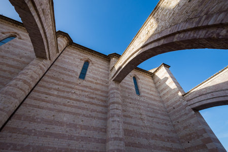 Assisi, Perugia, Umbria. Basilica of Santa Chiara, an important place of worship in the historic center of Assisi, built in Italian Gothic style in 1265.の写真素材
